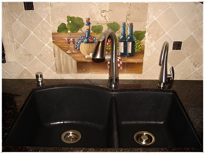 A newly repaired kitchen faucet on a double sink with a stylish backsplash