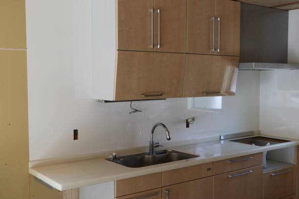 Newly installed stainless steel sink enhances modern kitchen countertop