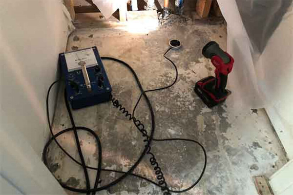 Slab leak detection process underway with professional tools